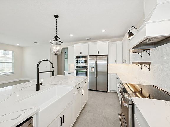 Kitchen with white apron-front sink