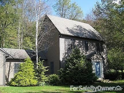 Front of House : Great variety of trees, bushes, green grass, stone walls