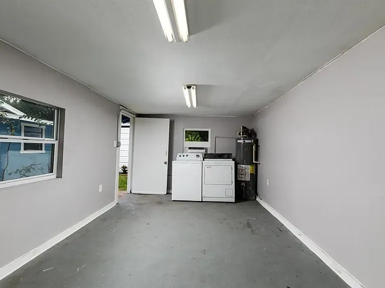 Laundry/Recreational room. Brand new washer not featured in photo.