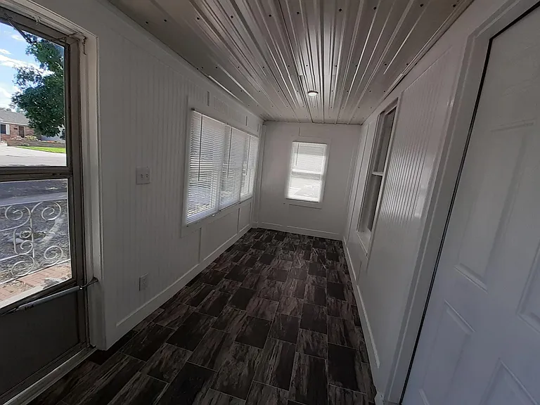 Bright enclosed Sunporch/Mudroom.