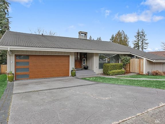 This home has abundant curb appeal - the new garage door is a perfect accent to the mid-century modern design! The entry is so warm and welcoming and features a gorgeous stacked stone wall and a beautiful front door. This home is immaculate and truly move-in ready.The driveway and entry stairs feature stamped concrete. Fairwood amenities include security patrols, parks, a tranquil setting and award-winning schools. Easy access to freeways, SeaTac airport, hospital, major retail, dining and business hubs.