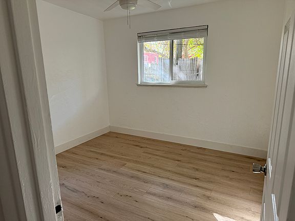 Bedroom with new flooring and fresh paint