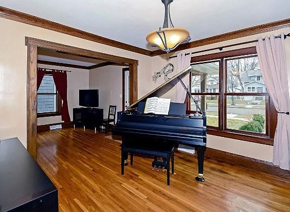 The formal dining room is currently used as a music room.