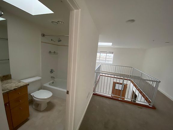 Master bathroom, partial view of the bedroom