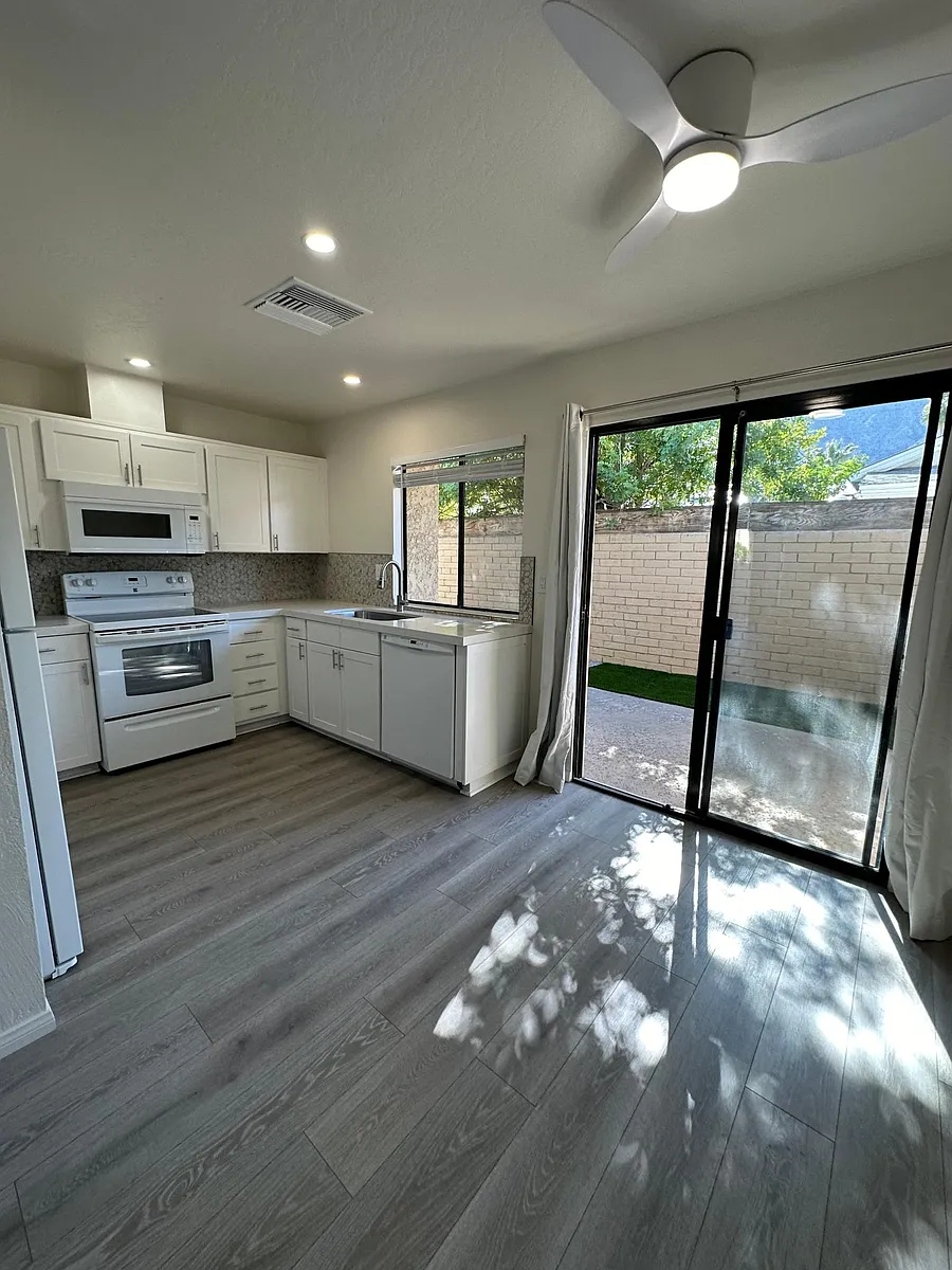 Kitchen with slider to backyard - 955 E Parocela Pl