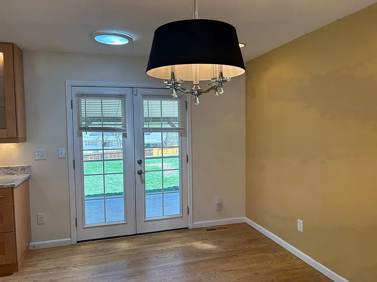 dining area and back french doors that lead to the covered back porch and yard