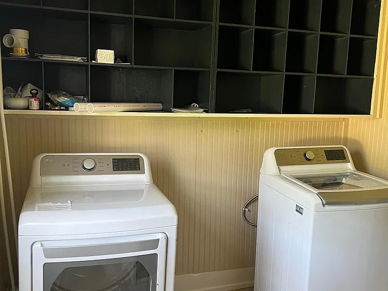 Laundry/pantry off kitchen with exterior entry door to the left