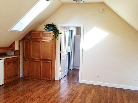 Gorgeous high end pergo flooring - skylights - built-in cabinets. The ceiling fan is beautiful and powerful.