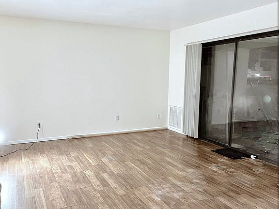 Large spacious Living area with sliding door opening to very spacious patio.