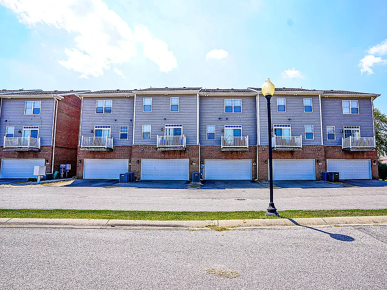 The Reserve's townhomes include attached garages on the lower levels.