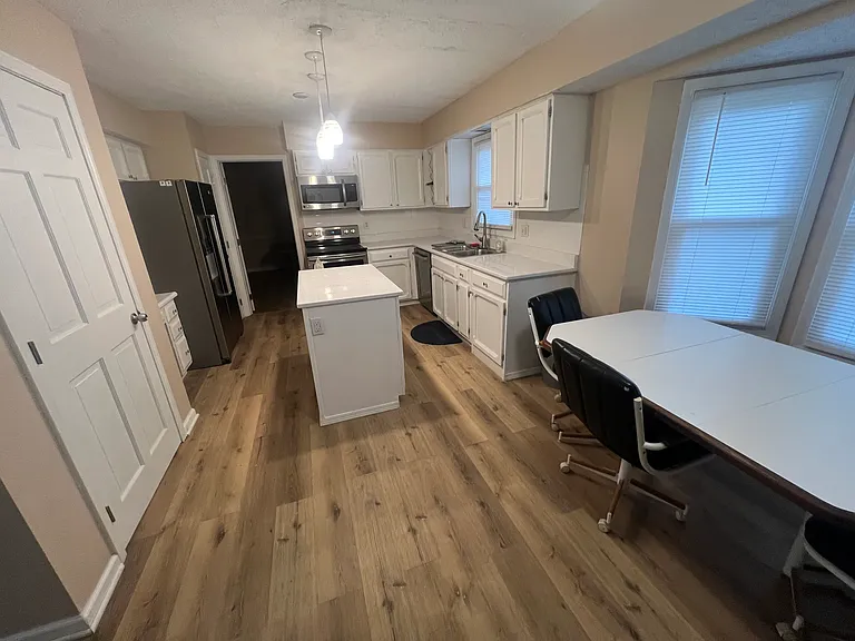 Newly remodeled furnished kitchen with stainless steel appliances, granite countertops, new LVP flooring, freshly painted, new kitchen lighting, custom wine rack, There is a 1/2 bath on the main floor. This home has 2 full baths and 2 1/2 baths.