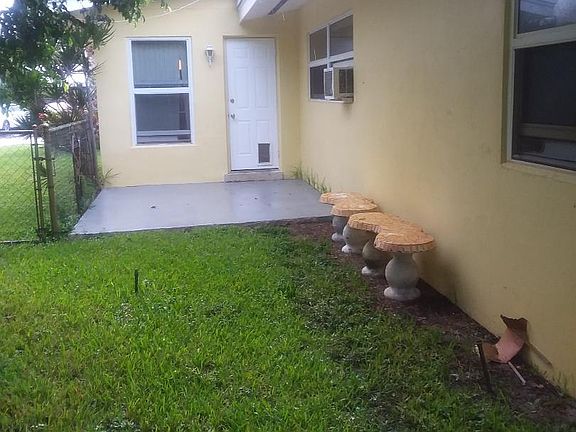 Side yard with concrete patio