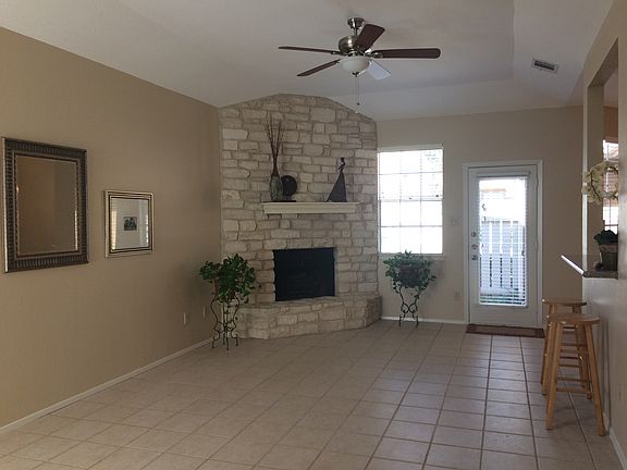 Spacious living room with lots of natural light, tall ceilin