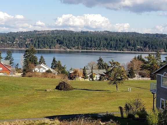 Picture perfect views looking over the golf course and harbor.