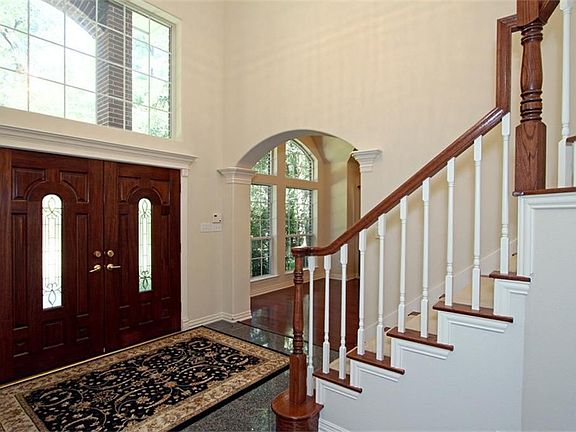 Elegant 2-story entry with granite floor as you enter the double front doors,