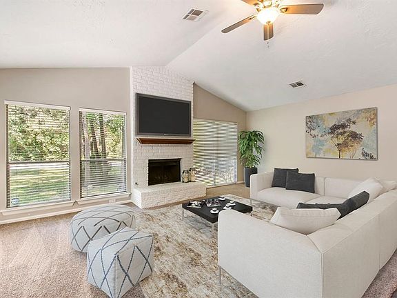Located in the heart of the home, this spacious and open family room is perfect for either relaxing or entertaining.  This picture shows you what the home would look like with furniture and decor.