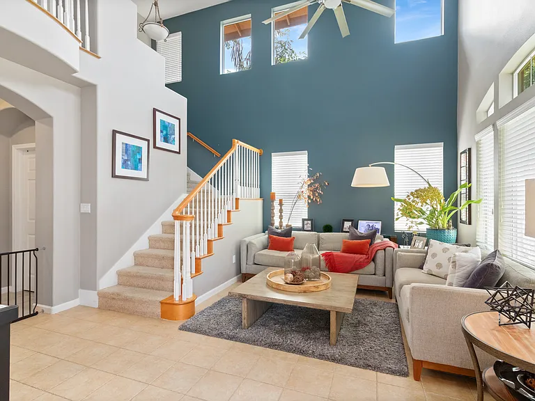 Living room with a high ceiling.