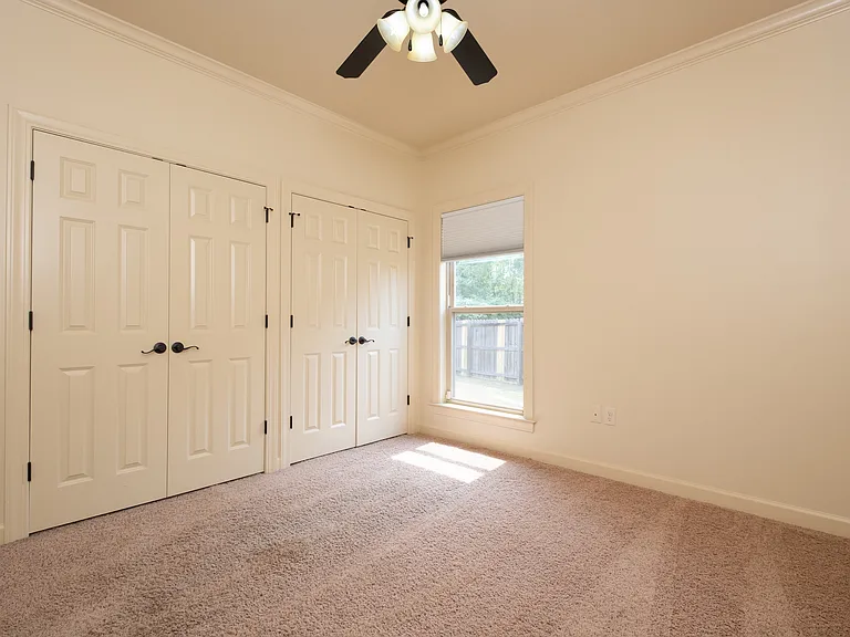 Bedroom #3 with two large closets or storage.