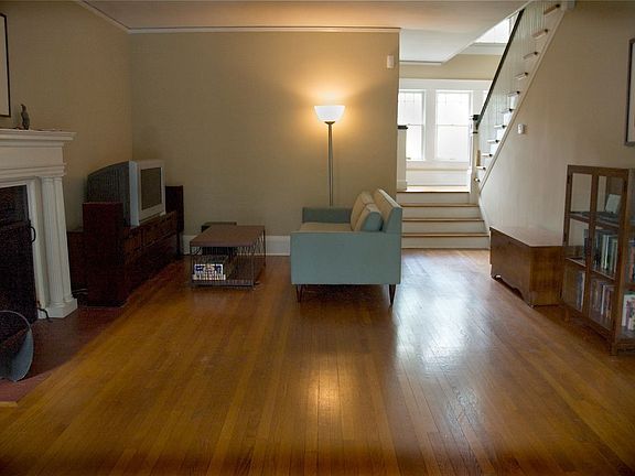 Living room with working wood-burning fireplace