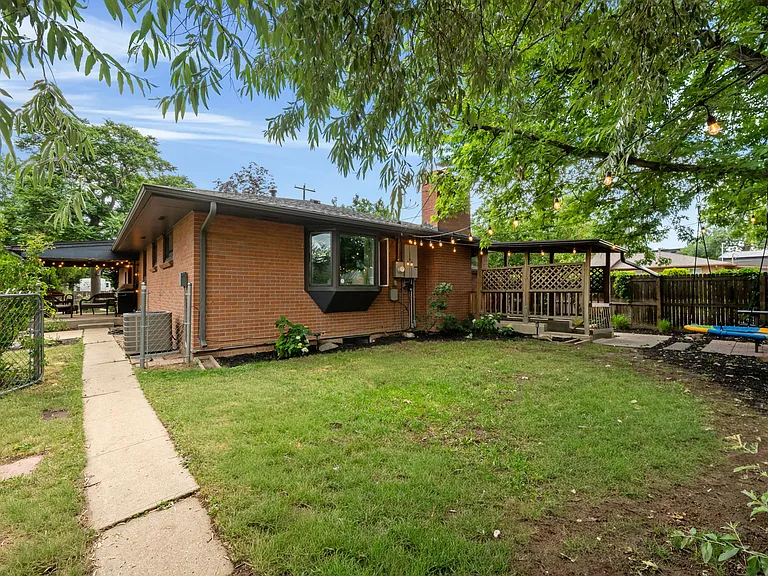 Basement apartment entrance_private exterior access; interior access also available via lockable door off main-level dining area