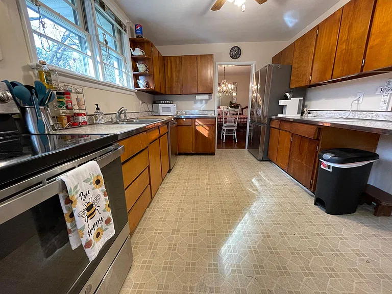 Kitchen has nice flow to the Dining Room and a lovely view of the beautiful chandalier
