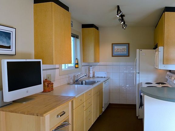 Kitchen with partial view of the bistro bar to the right.