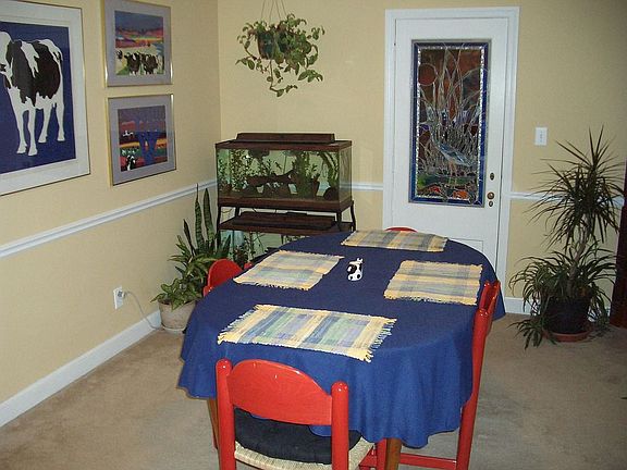 Formal dining room opens to screened porch.