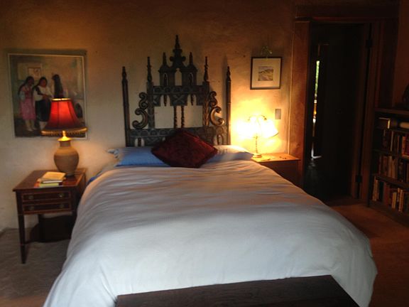 the main bedroom with view across valley to the mountains and with large bathroom en suite