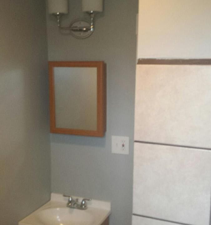 new tile, tub, toilet, sink, lighting, drywall, paint