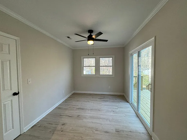 Sunroom with pantry storage and deck access