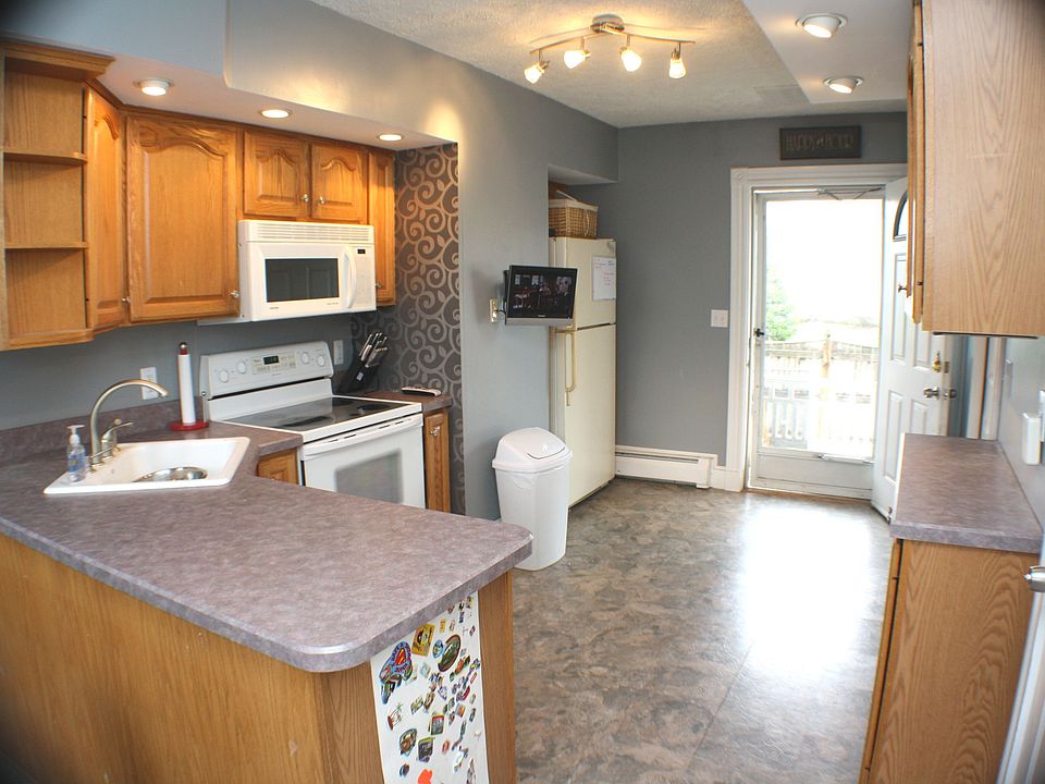Kitchen, door to porch and yard