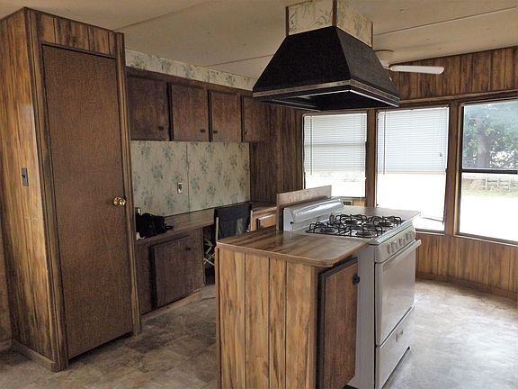 Island kitchen with bay windows, pantry and loads of cabinet