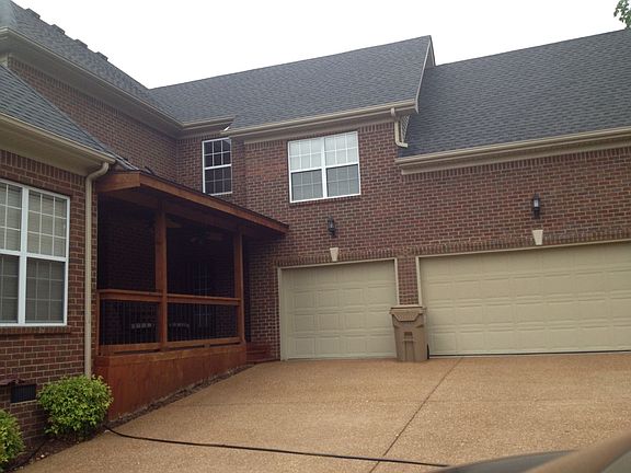 3-car garage with two doors.  Covered patio with ceiling fans