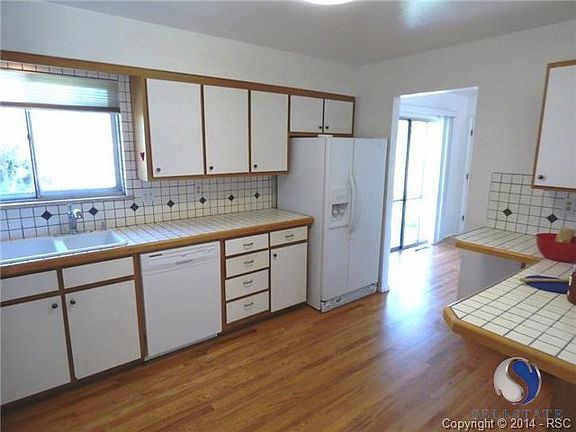 Kitchen features solid wood cabinets and plenty of counter space