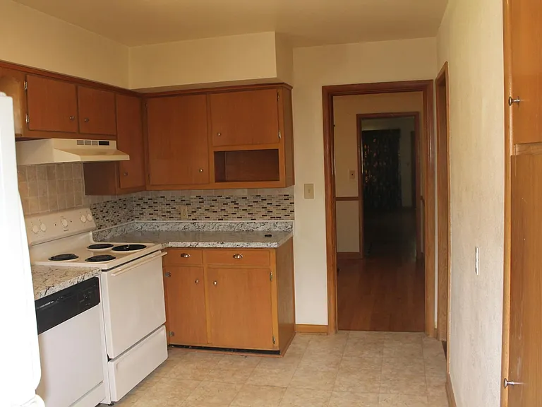 Kitchen into Dining room then into Living room