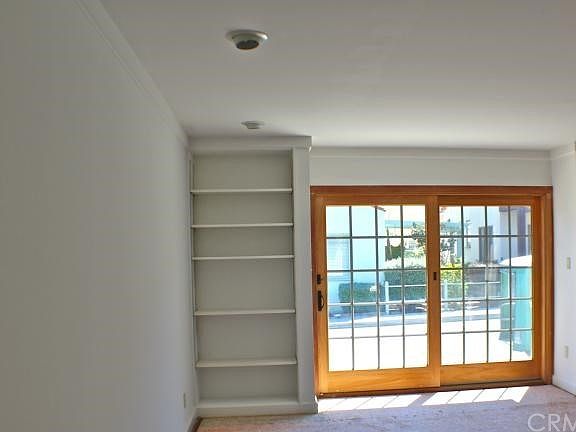 Bright Living Room with Sliding Door to Brick Porch
