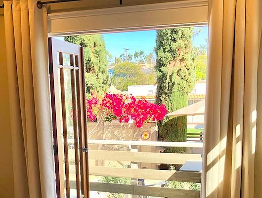 View from inside double glass doors to front porch
