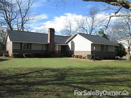 Front
						:
						Brick & Vinyl, 2-Car Garage on right not in view; fenced backyard.