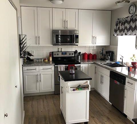 Kitchen has new cabinets, new appliances and granite counter tops