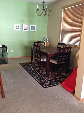 Large dining room; carpet has since been replaced with luxury vinyl plank (LVP) flooring