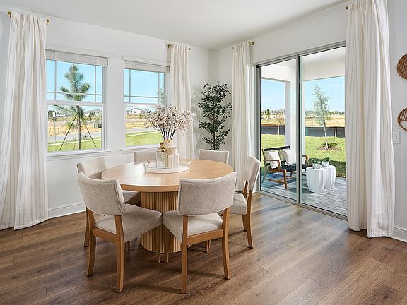 Dining room in the Birch floorplan modeled at Cyrene at Minneola