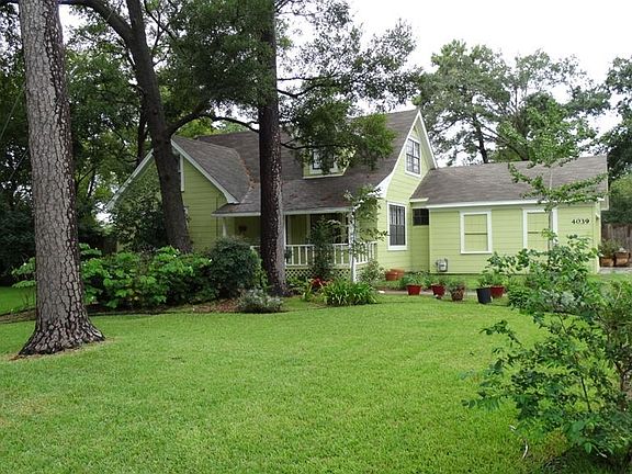 Large yard with mature trees and lots of landscaping