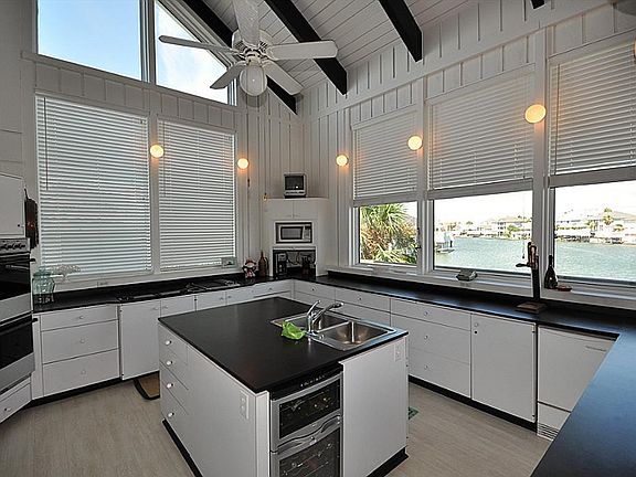  Island kitchen with wine cooler, double ovens, subzero refrigerator/freezer, Jenn-air 4 burner cook top with separate griddle and ice maker.