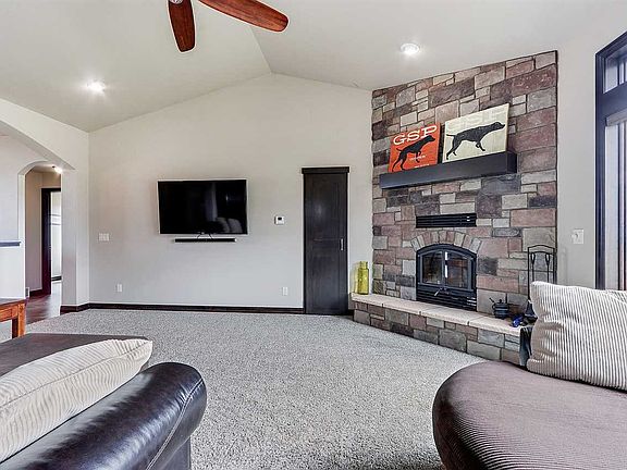 Woodburning Fireplace with wood closet to the left of FP