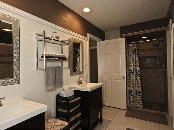 Master Bath view of vanities and shower. Suits the busy morning routine.