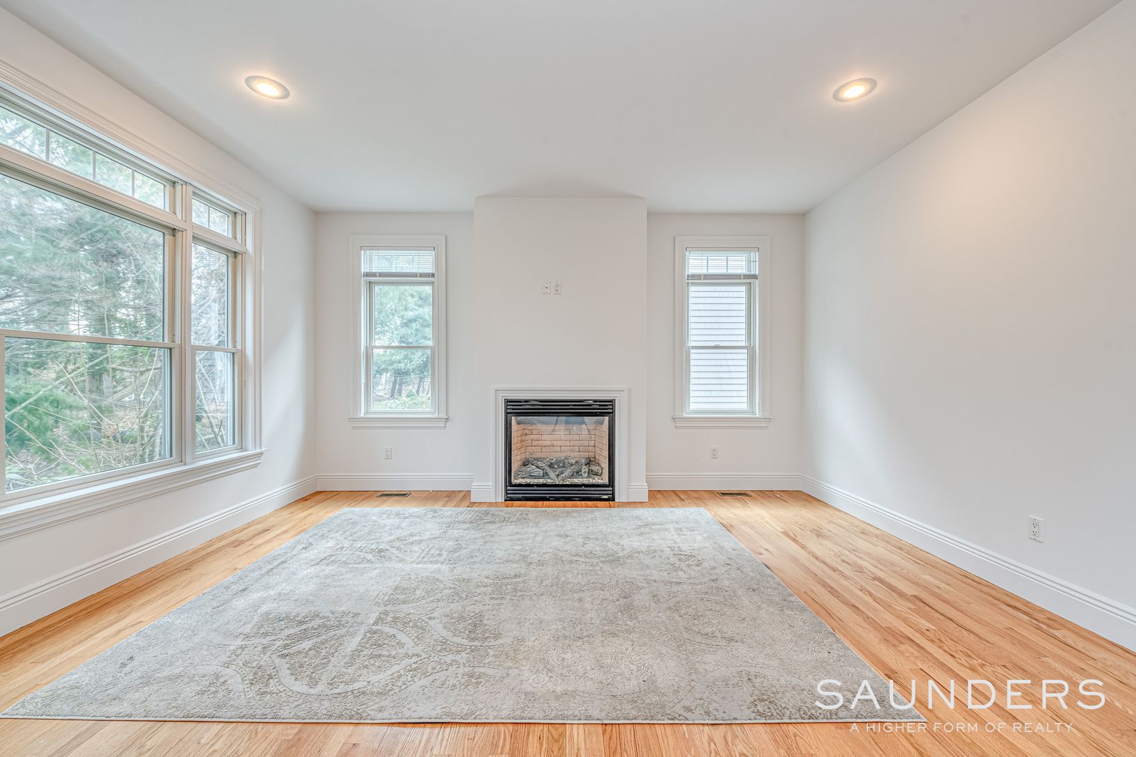  Den with gas fire place and lots of natural light 