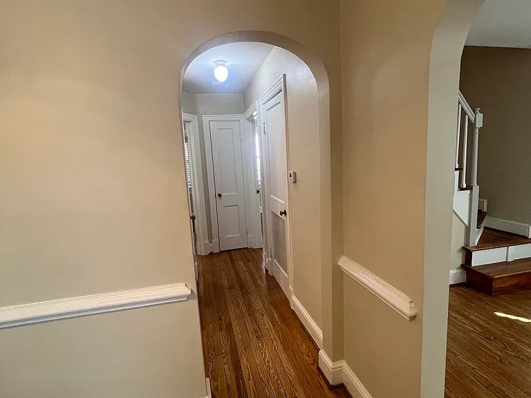 looking from kitchen dwon hallway to bath on left and back two bedrooms