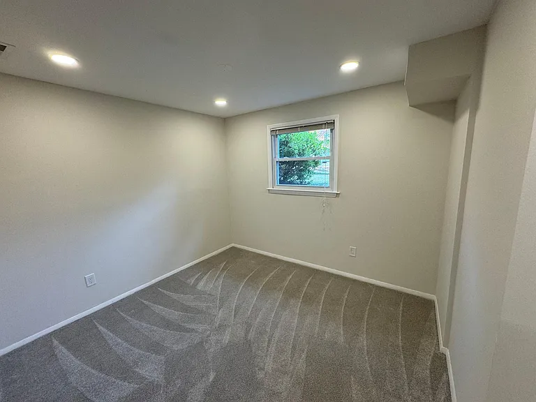 Lower level office with new carpet.