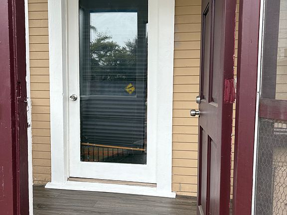 Enclosed front porch area.