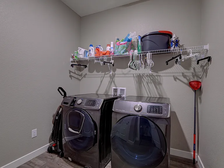 Large laundry room with additional storage